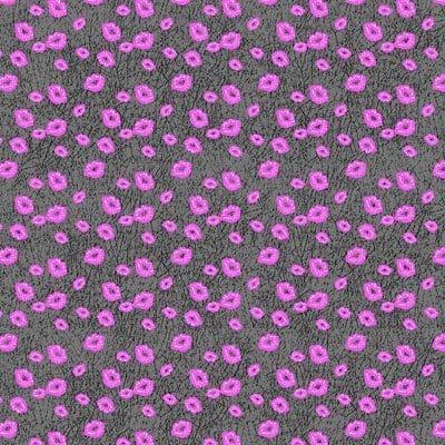 A textured fabric with a gray background features scattered pink dots. The dots are irregularly shaped  creating a playful pattern across the entire surface of the fabric.
