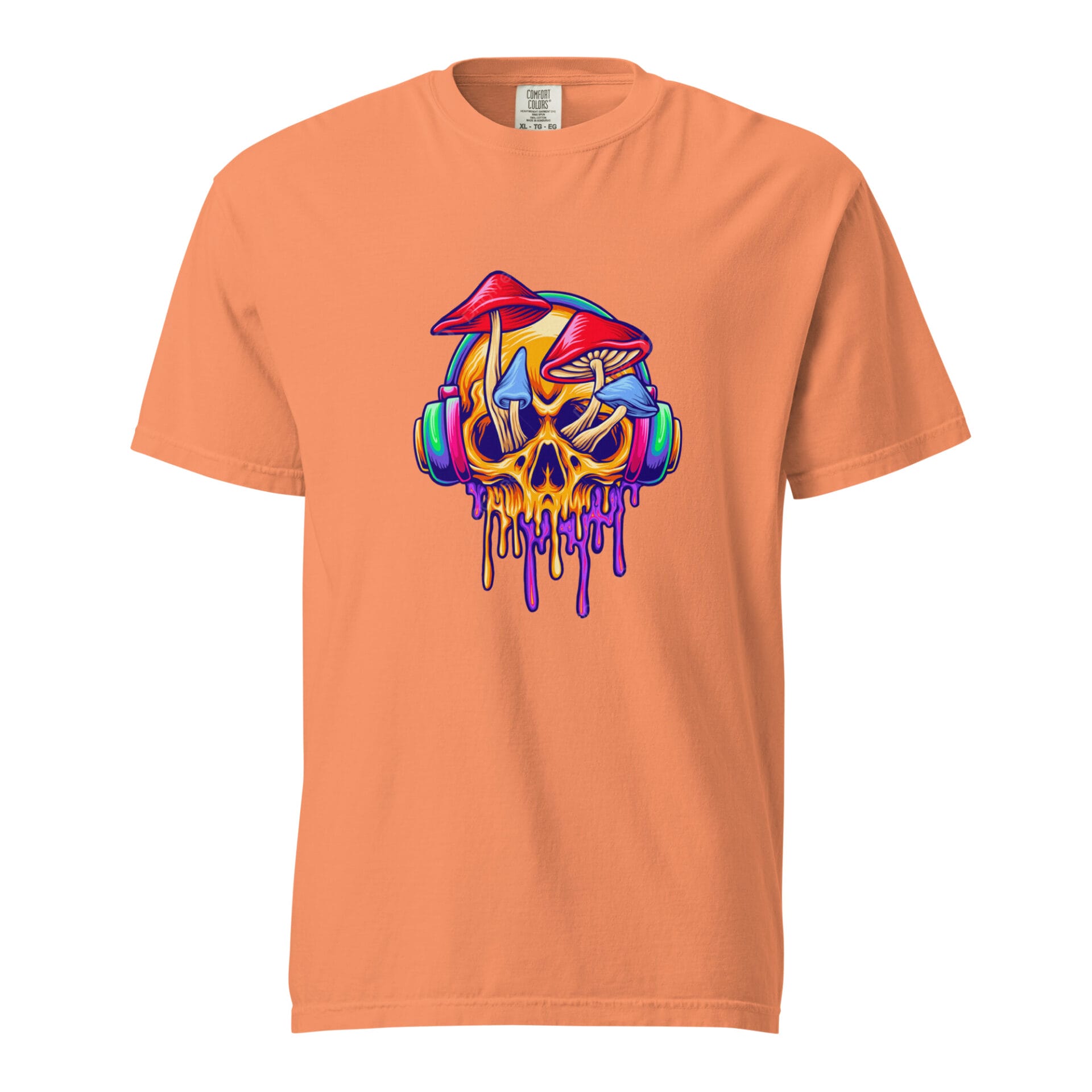 An orange t-shirt features a graphic design of a skull wearing headphones dripping with colorful paint accompanied by vibrant mushrooms on top against a plain backdrop.